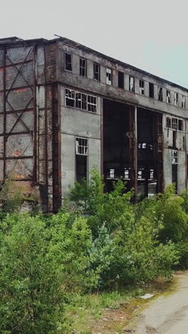 destroyed factory after the bombing of the city of donetsk ukraine. vertical video