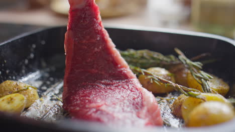 cooking meat steak with potatoes