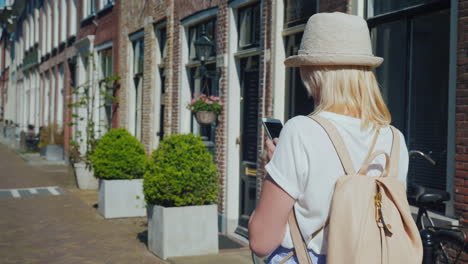 a woman in a hat on dutch street