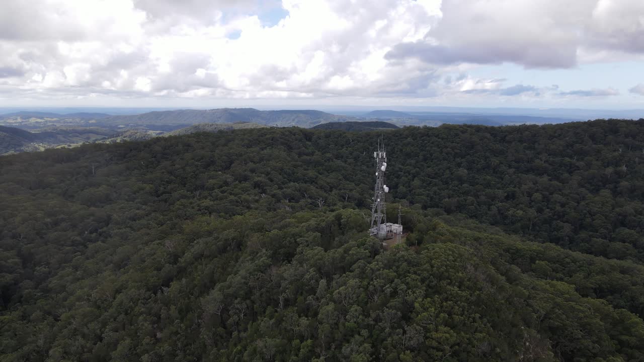 Aerial drone above cell tower in the heart of a mountain range, Mount Boulder