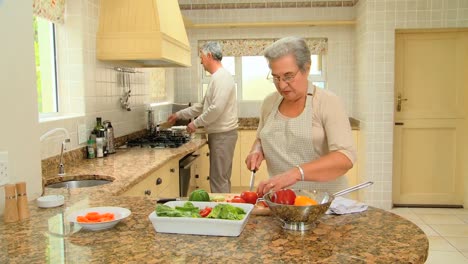 retired couple cooking