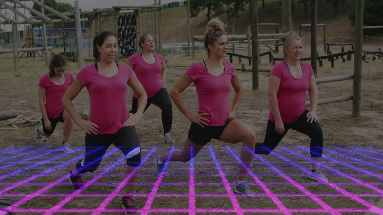 Women in pink shirts exercising over digital grid animation in outdoor setting