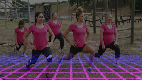 women in pink shirts exercising over digital grid animation in outdoor setting