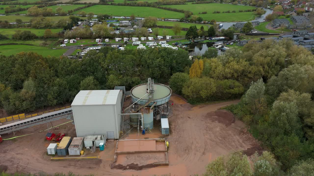 Cinematic High Altitude Footage of a Gypsum Processing Building Situated Beside a Static Caravan Site in Sileby Leicestershire England UK