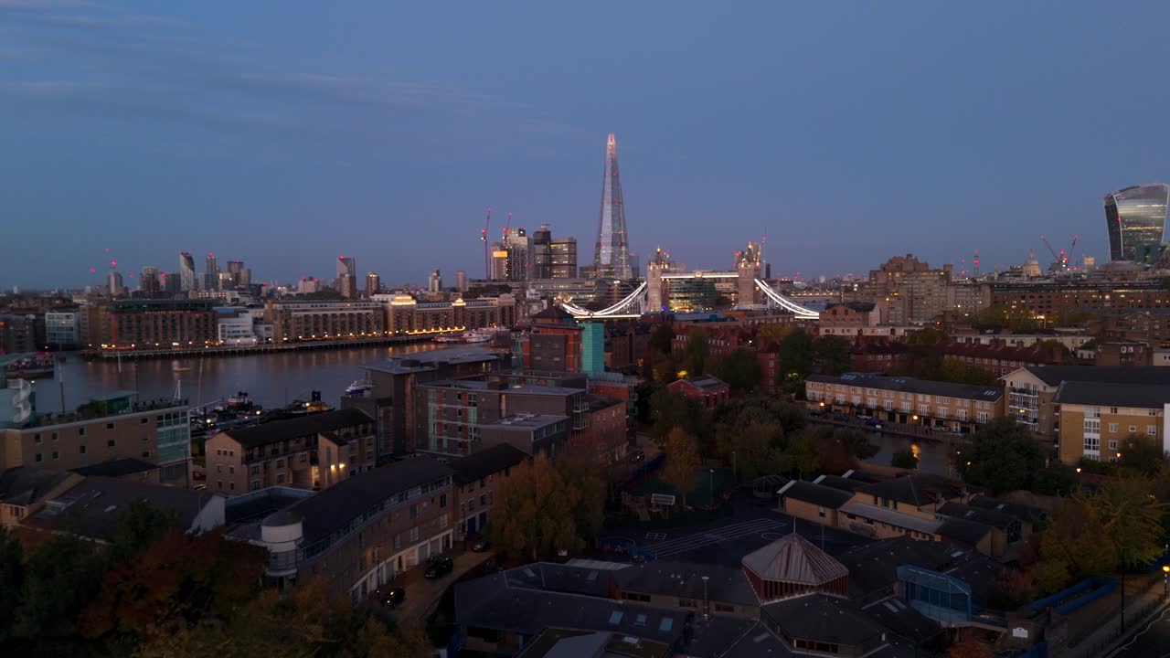 Drone flying over Wapping in London with view of The Shard and Tower Bridge
