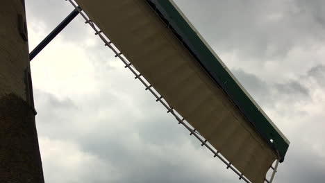 following spinning windmill blades at kinderdijk in amsterdam, holland, netherlands, hd