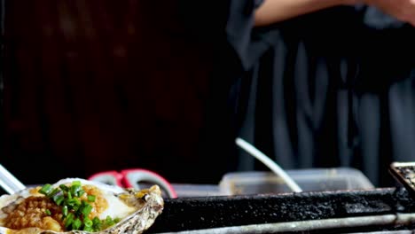 grilled oyster street food preparation