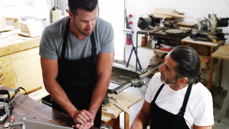 Two-carpenters-having-a-serious-discussion