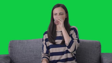 sick indian girl taking medicine green screen