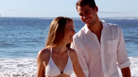 attractive couple walking hand in hand