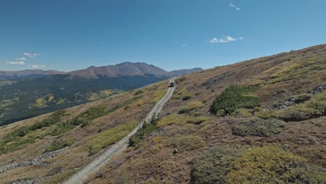 jeep driving on a mountain trail