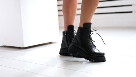 black platform ankle boots on legs