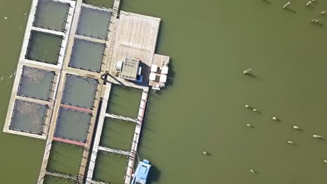 aerial drone view over boat docks bridge and small town on a hill