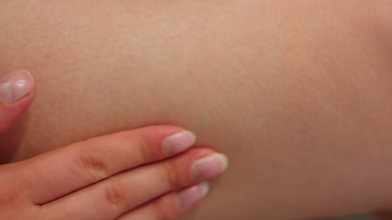 Close-up view of hand massaging cream into skin, part of moisturizing routine, skin care, rejuvenation, body treatment, smooth skin, healthy skin, self-care moment, body moisturizing