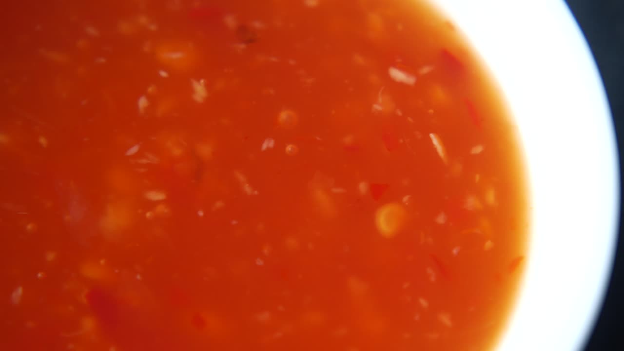 Premium stock video Tomato chili sauce in a jar on table
