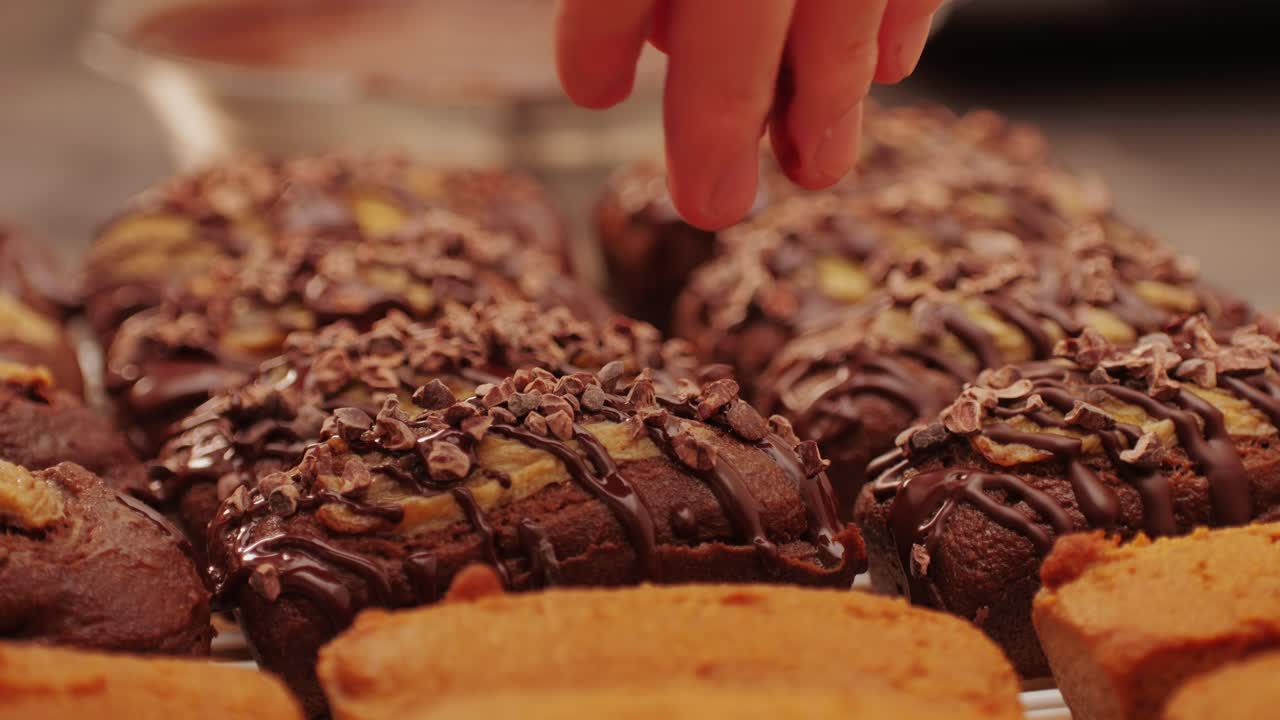 Fresh bake double chocolate banana artesian bread in bakery shop close-up. Artisan bread is making by skill bakers using natural and high-quality ingredients. Food with health and flavour benefits. Sweet breads for dessert and breakfast