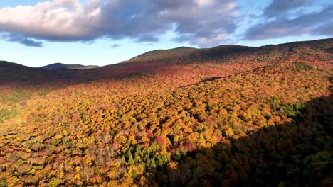 aerial pullout from vibrant leaf color near stowe vermont in new england in fall