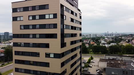 cinematic shot of high rise building with city scape in the back