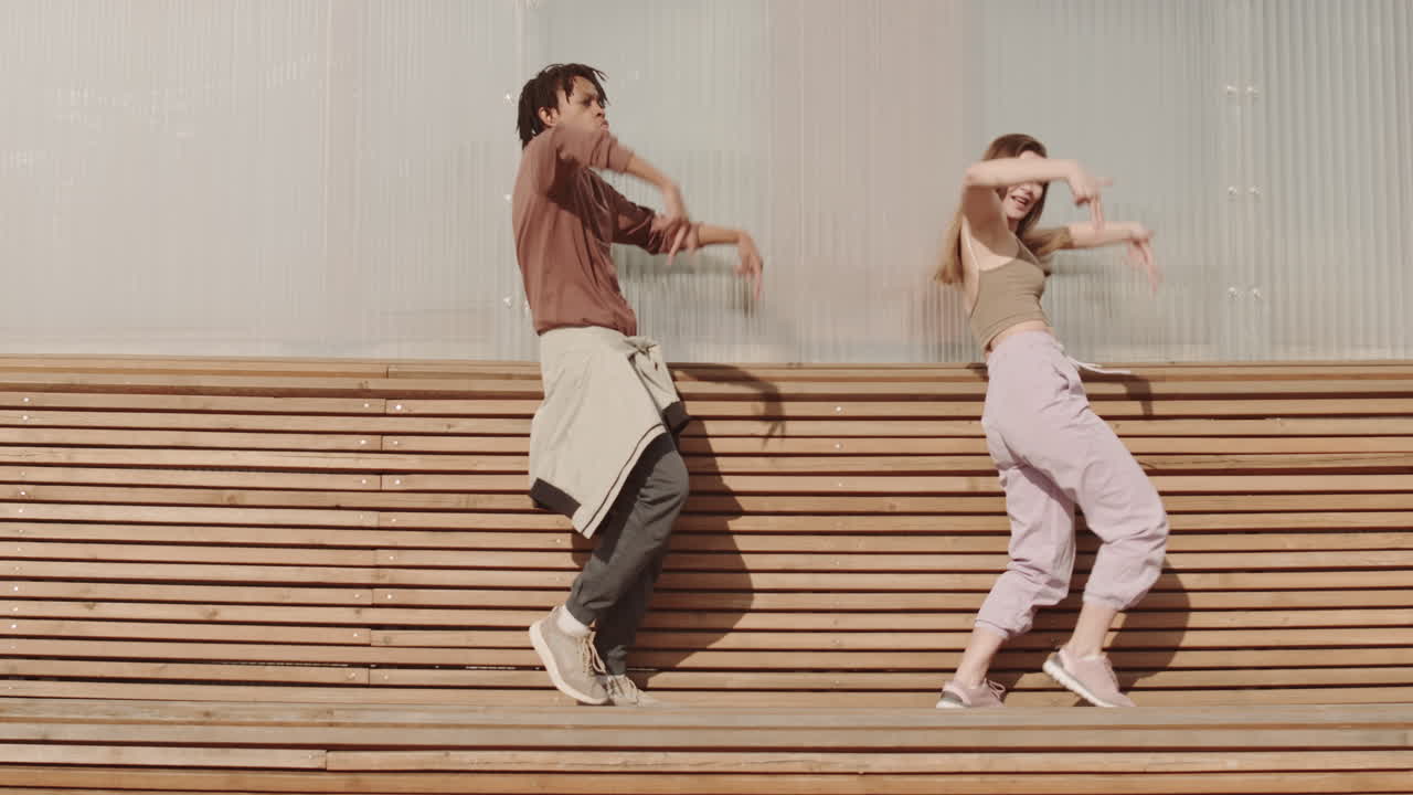 Diverse Performers Dancing on Long Bench