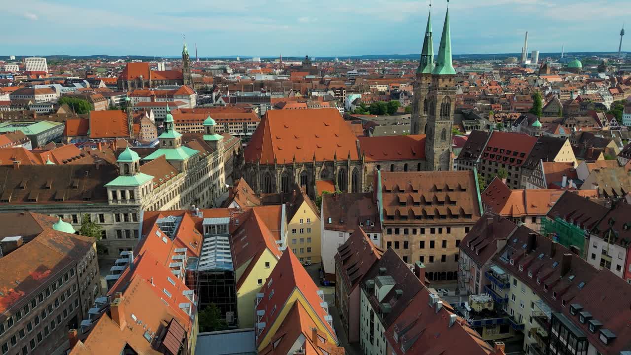 4K Aerial Drone Video of the Copper-clad Twin Spiers on the Beautiful St. Sebald Church in Downtown Nurnberg, Germany