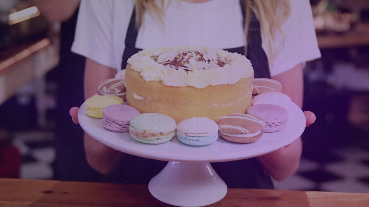 On camera pan up server raising cake stand showing dessert in cafe with transparent graphs floating