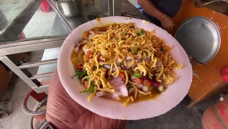 Aloo-tikki-chat-Jharkhand-Street-food-made-of-potato-Patties-white-beans-serve-with-tamarind-cilantro-chutney