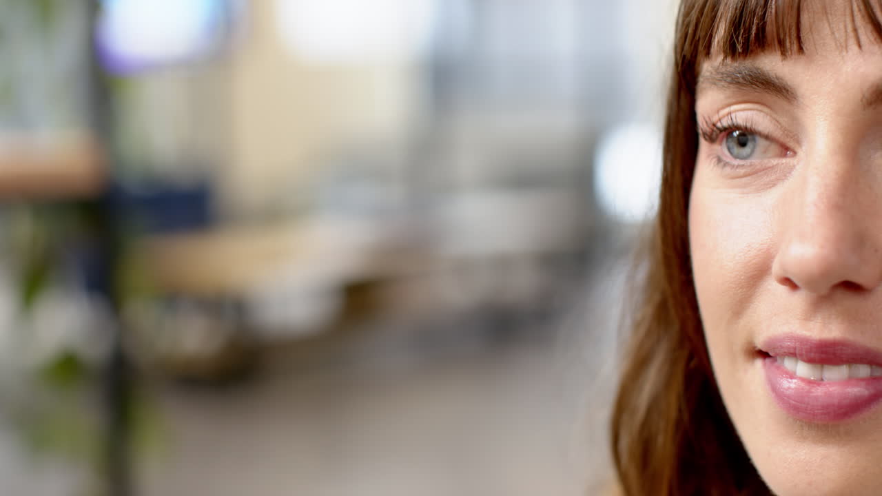 Smiling woman in office, focusing on creative writing business project