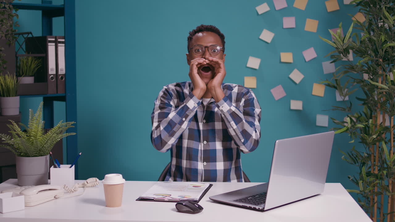 Excited man whispering secret and gossip in front of camera