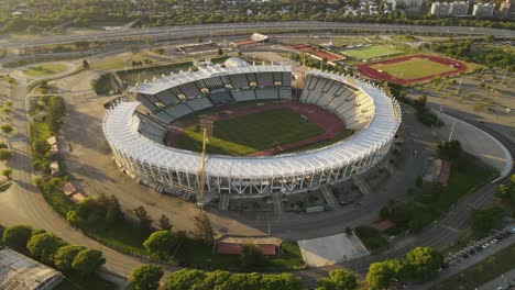 aerial view of football stadium in cordoba and freeway with traffic in background