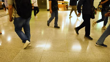 commuters moving through a busy subway station