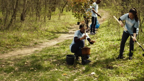 Team-of-climate-change-activists-doing-voluntary-work-to-plant-trees