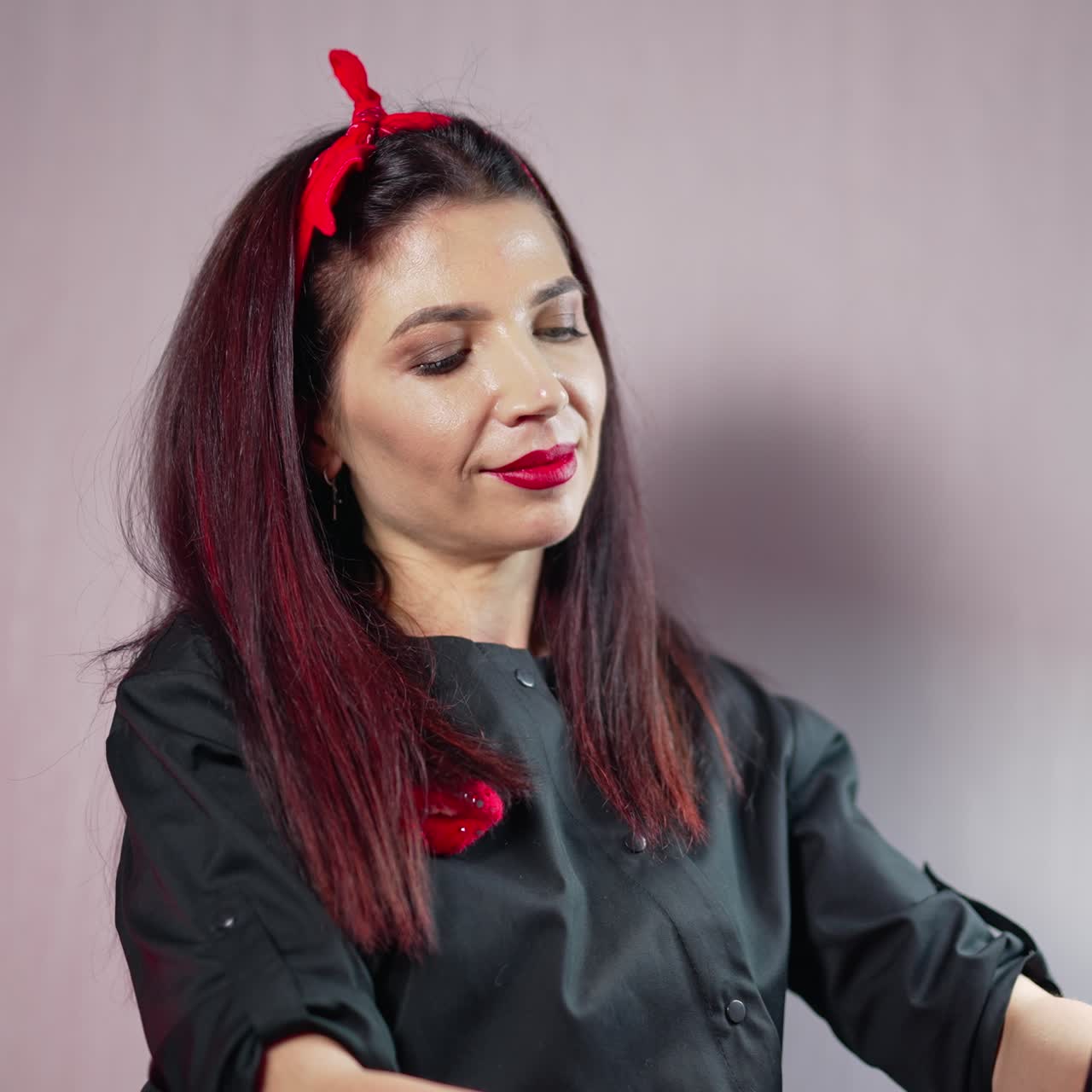 Cosmetologist making permanent makeup. Beautician female holding equipment and preparing to applying permanent makeup on lips