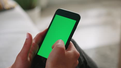 woman uses mobile phone with chroma key