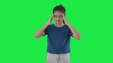 indian teenage girl having a headache green screen
