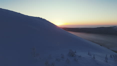 a-wonderful-winter-valley-is-revealed-behind-the-mountain