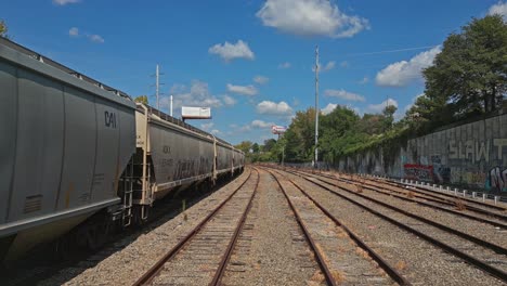 POV-shot-of-train-on-track-on-sunny-day-in-Atlanta-Ga