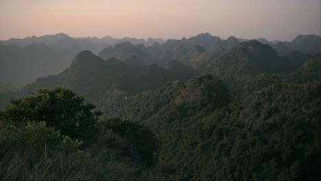 slow panning aerial view of range of limestone mountains in vietnam