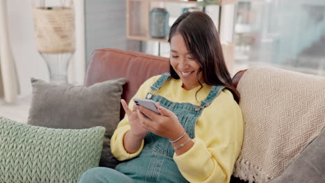 Smile,-relax-and-woman-with-phone-on-sofa