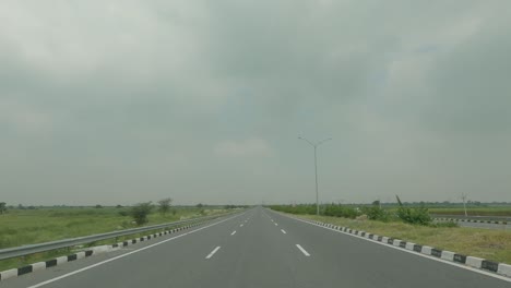 timelapse from the point of view of a vehicle riding through the western peripheral expressway inaugurated by prime minister narendra modi