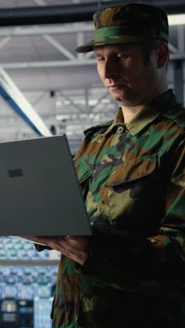 Vertical Video Soldier In Server Hub Using Laptop To Deploy Ai Tech, Modernizing Defense