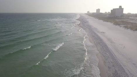 Long-Stretch-Of-Pensacola-Beach-In-Florida,-USA-On-A-Cloudy-Day---aerial-drone-shot