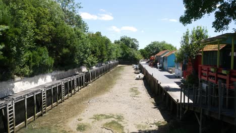 tilt up view of the coloured huts of oyster farmers in château-d'oléron, france