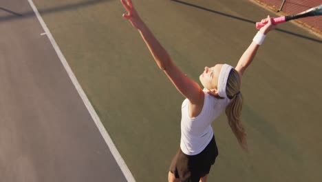 video of top view of caucasian female tennis player holding racket and hitting ball