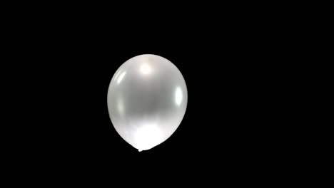 experience the beauty of a single silver balloon floating gracefully through the display. this elegant moment captures the smooth movement of the balloon, offering a peaceful and captivating visual.