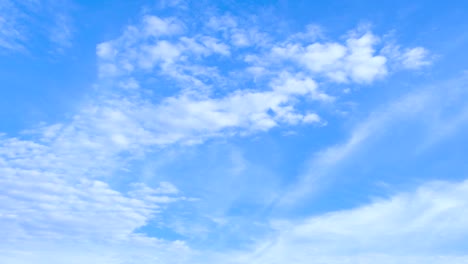 time lapse clouds and blue sunny sky, loop of white clouds over blue sky with sun rays, aerial view, clouds motion time, nature blue sky a white clear weather. 4k video.