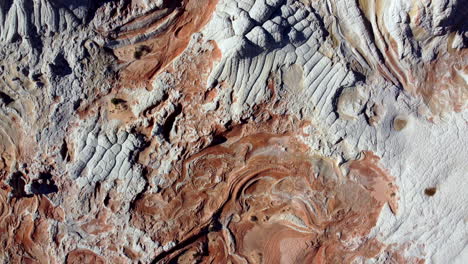 top down panning drone shot of the rock formations of white pocket at the vermillion cliffs national monument, arizona, unites