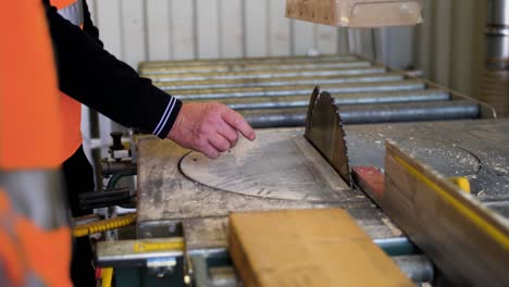 Man-in-front-of-a-wood-cutting-machine