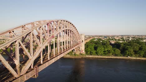 drone shot of old iron train bridge connecting manhattan and queens, new york