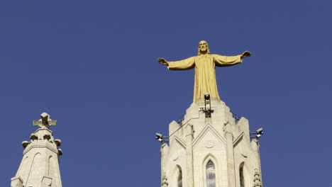 Statue of Jesus Christ atop a church tower