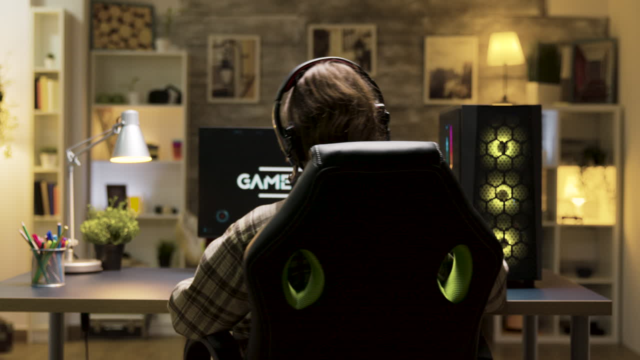Gamer playing on his computer